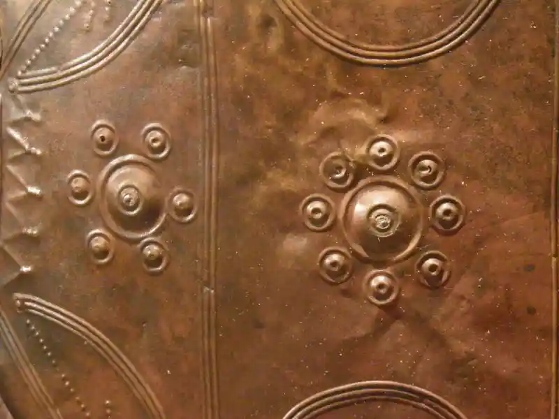 Bronze dish with a solar symbols in the center